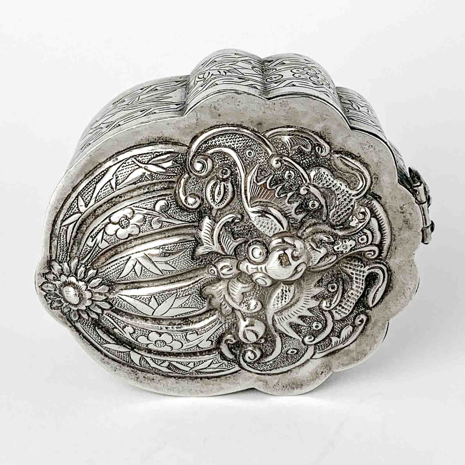 A small silver makeup-box decorated with bats and a peach, Qing Dynasty, China ca. 1880