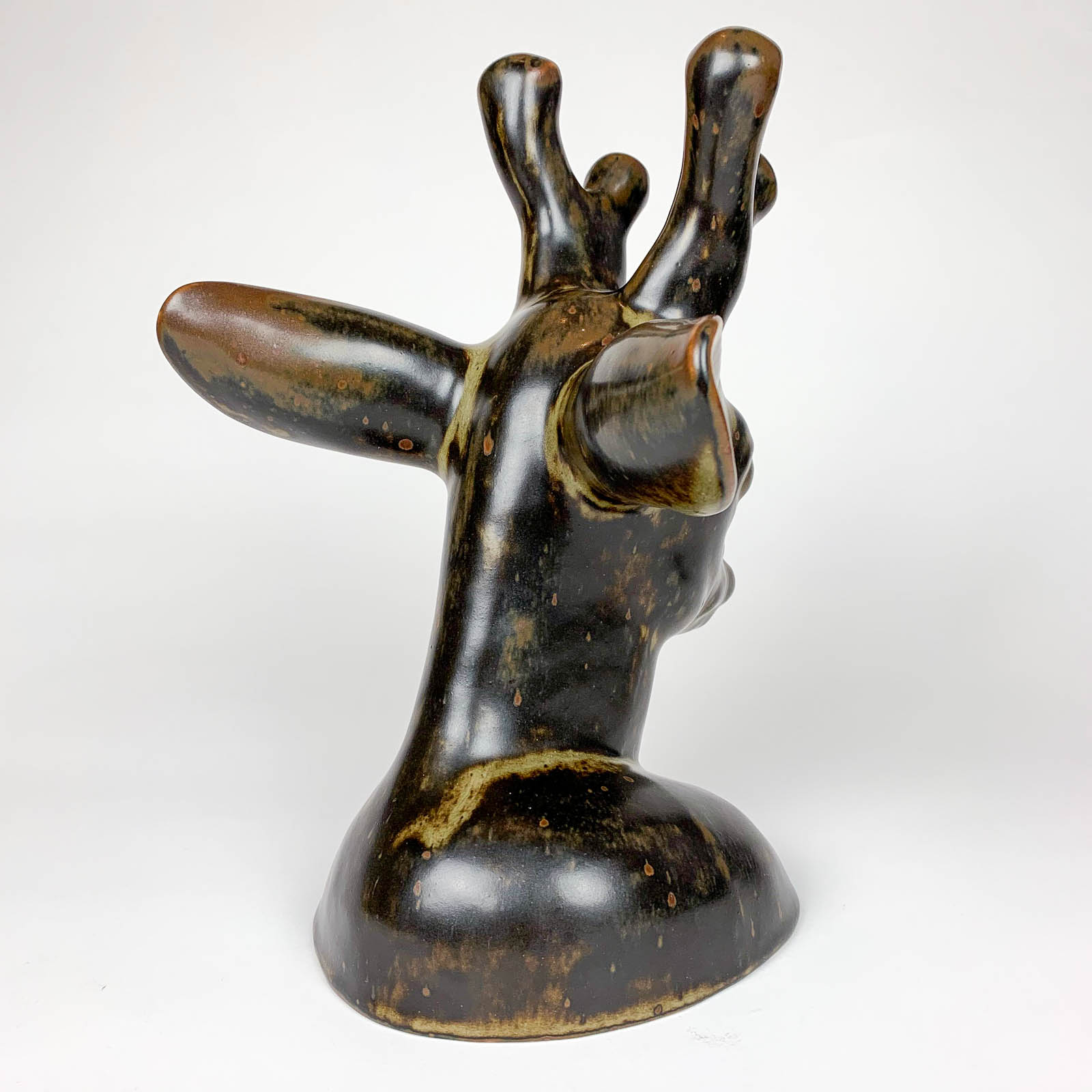 A stoneware Deerhead sculpture, model no: 20.803, sculpted by Axel Salto in 1946 and executed by Royal Copenhagen in 1950.