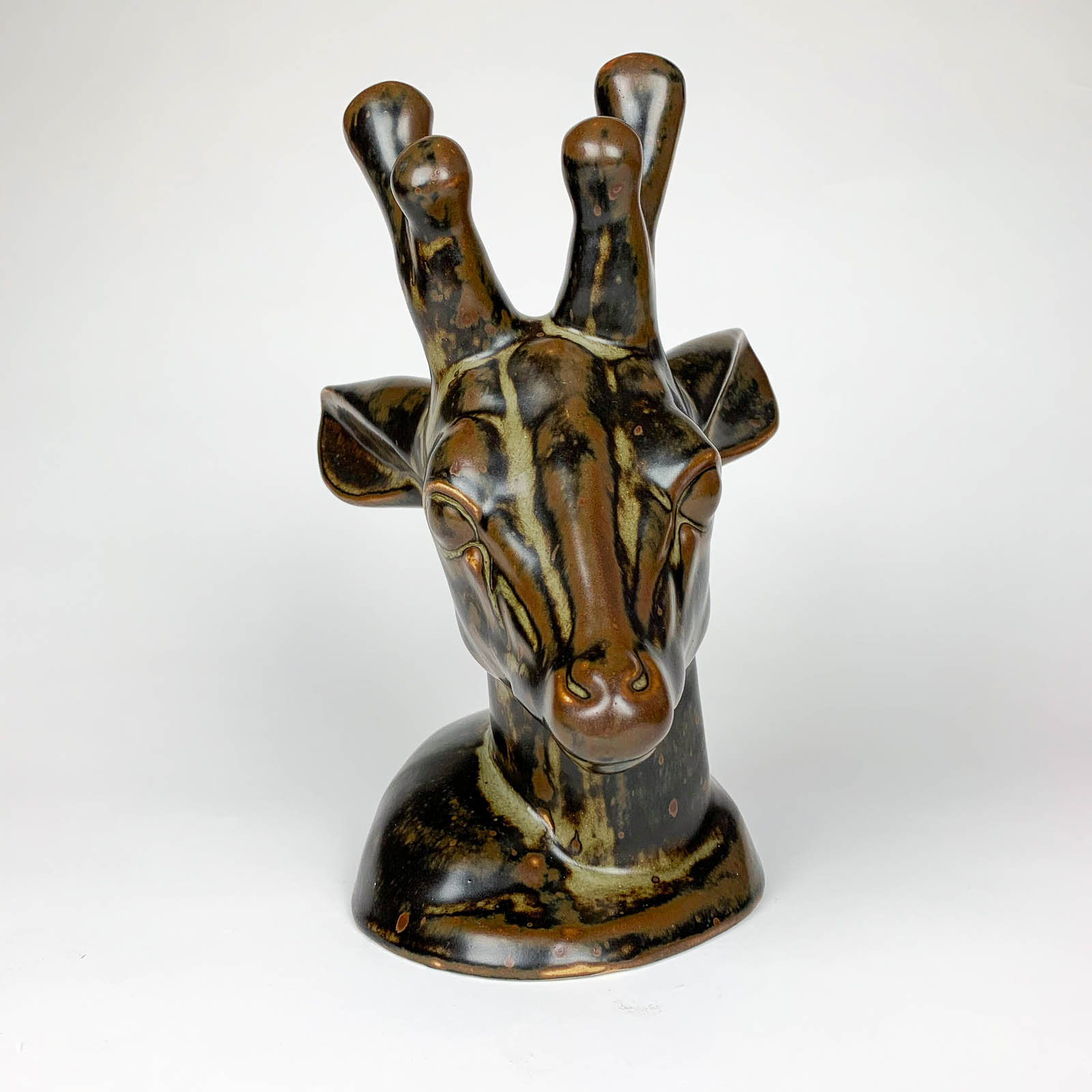 A stoneware Deerhead sculpture, model no: 20.803, sculpted by Axel Salto in 1946 and executed by Royal Copenhagen in 1950.