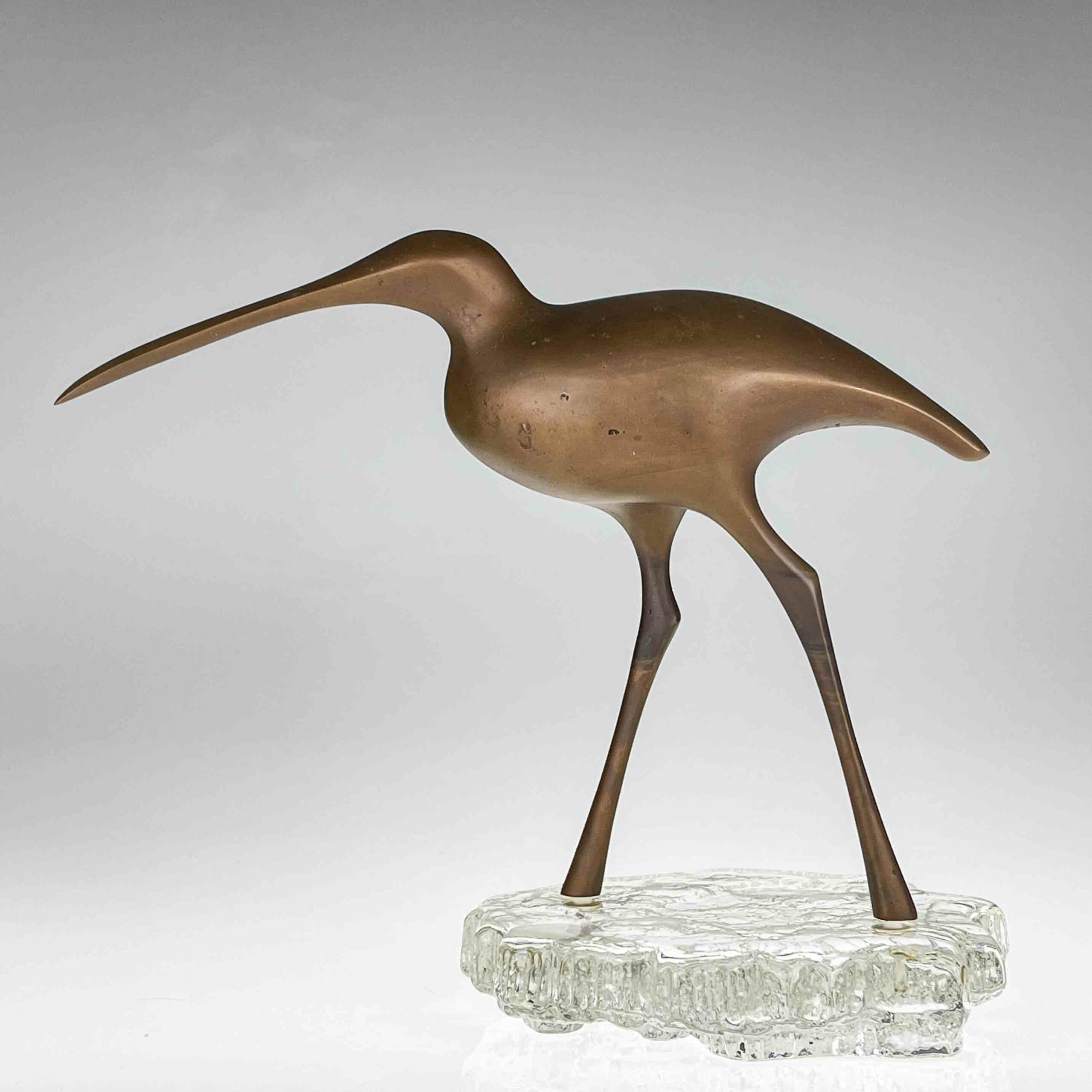 Tapio Wirkkala - A bronze sculpture of a bird "Suokurppa" on a glass stand, model TW 513 - Kultakeskus / Iittala, Finland ca. 1975