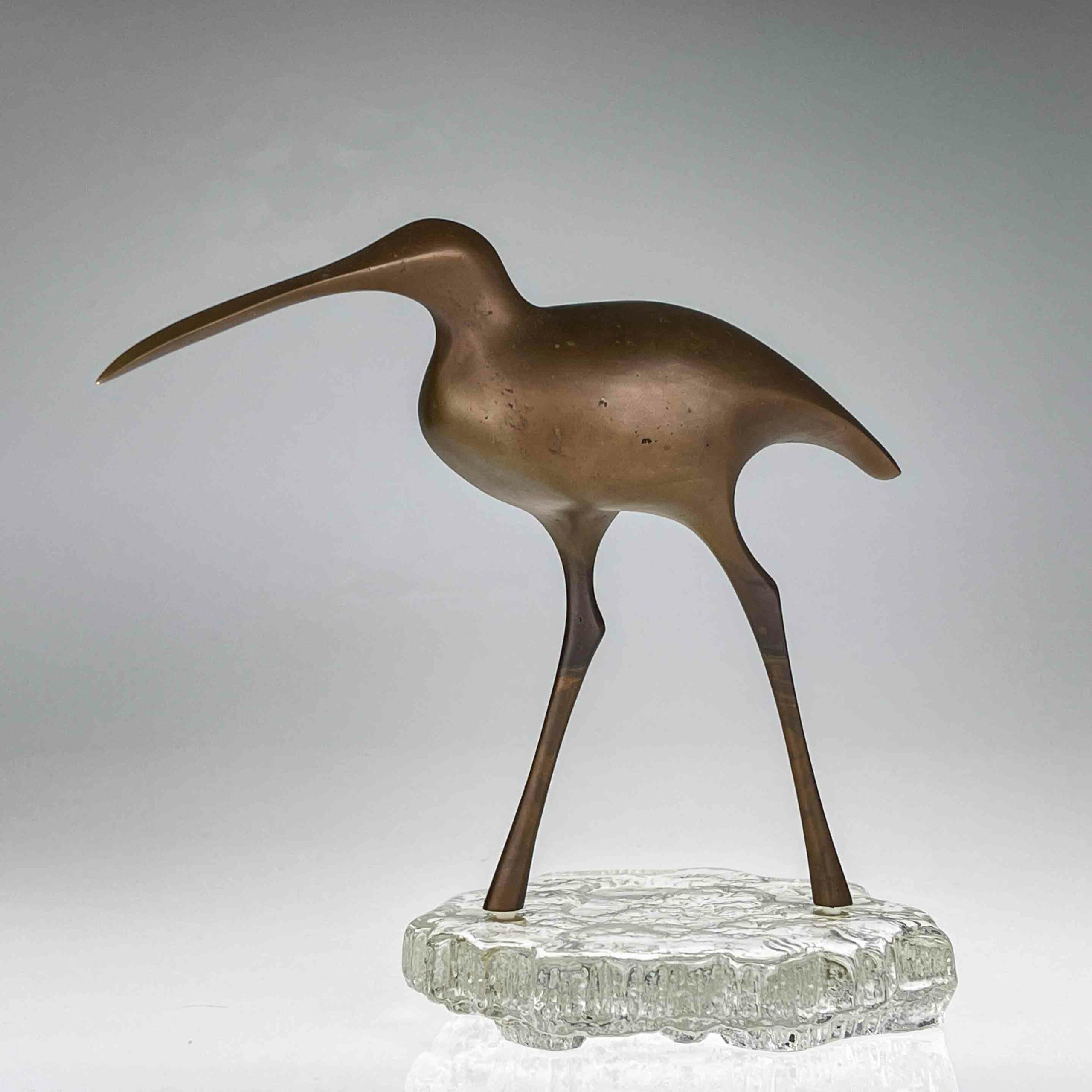 Tapio Wirkkala - A bronze sculpture of a bird "Suokurppa" on a glass stand, model TW 513 - Kultakeskus / Iittala, Finland ca. 1975