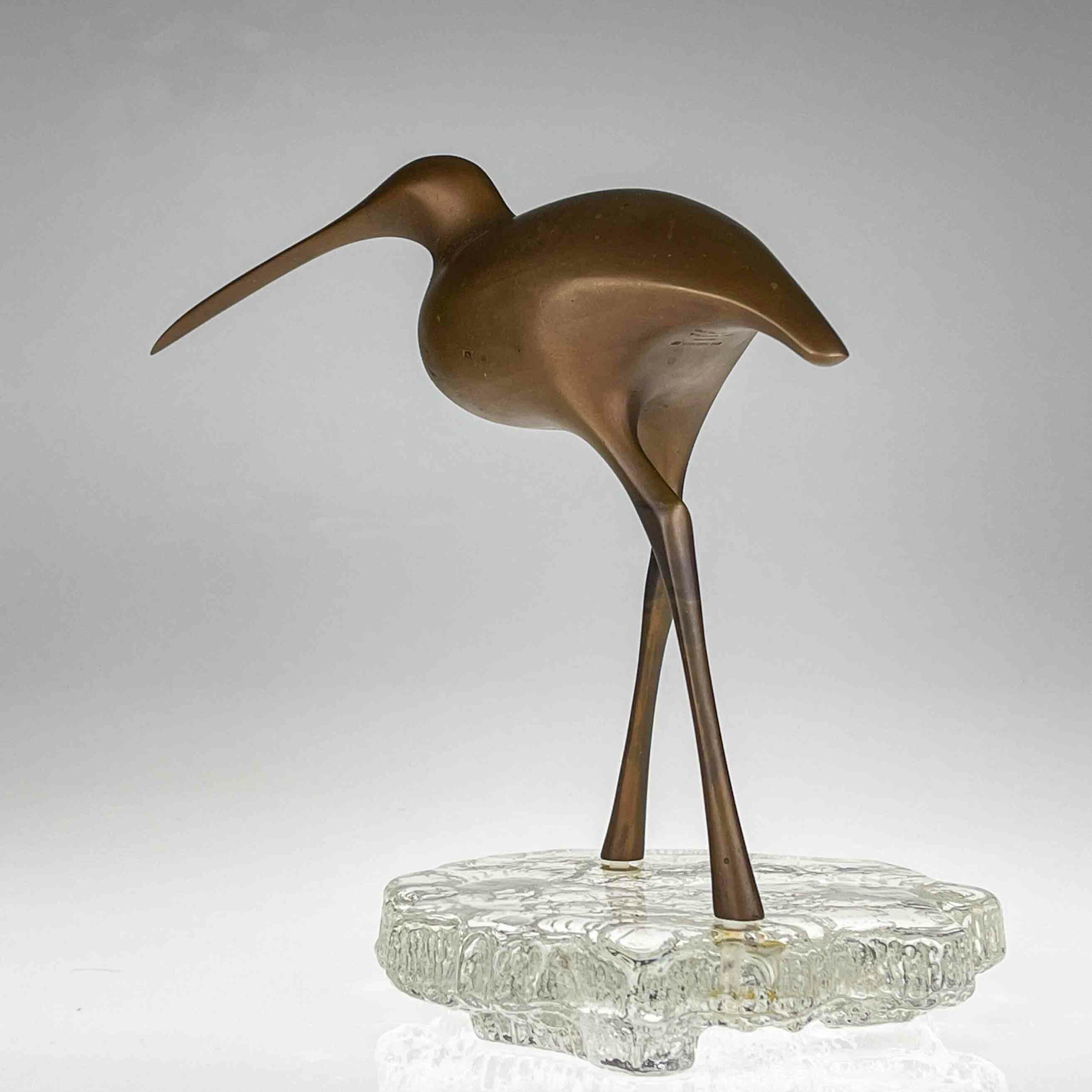 Tapio Wirkkala - A bronze sculpture of a bird "Suokurppa" on a glass stand, model TW 513 - Kultakeskus / Iittala, Finland ca. 1975