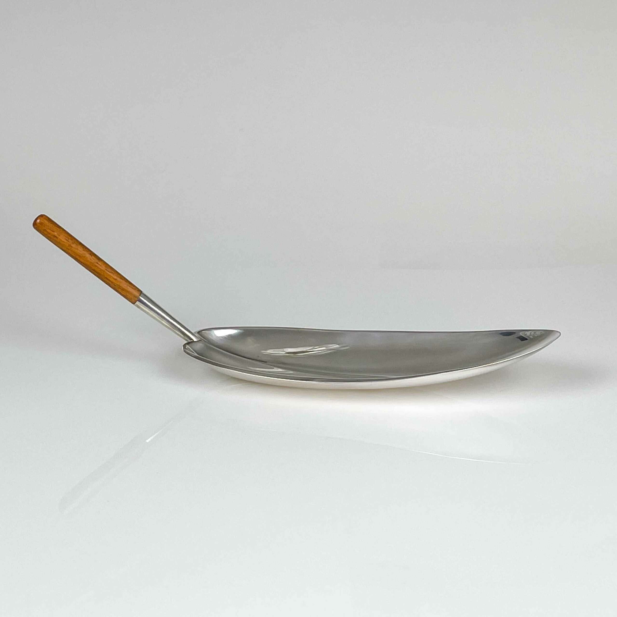 Tapio Wirkkala - A Sterling silver dish with teakwood handle, model TW85, Handmade to Order - Kultakeskus, Finland 1965